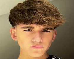 Tommy has a beautiful mole on the left side of his jawline.